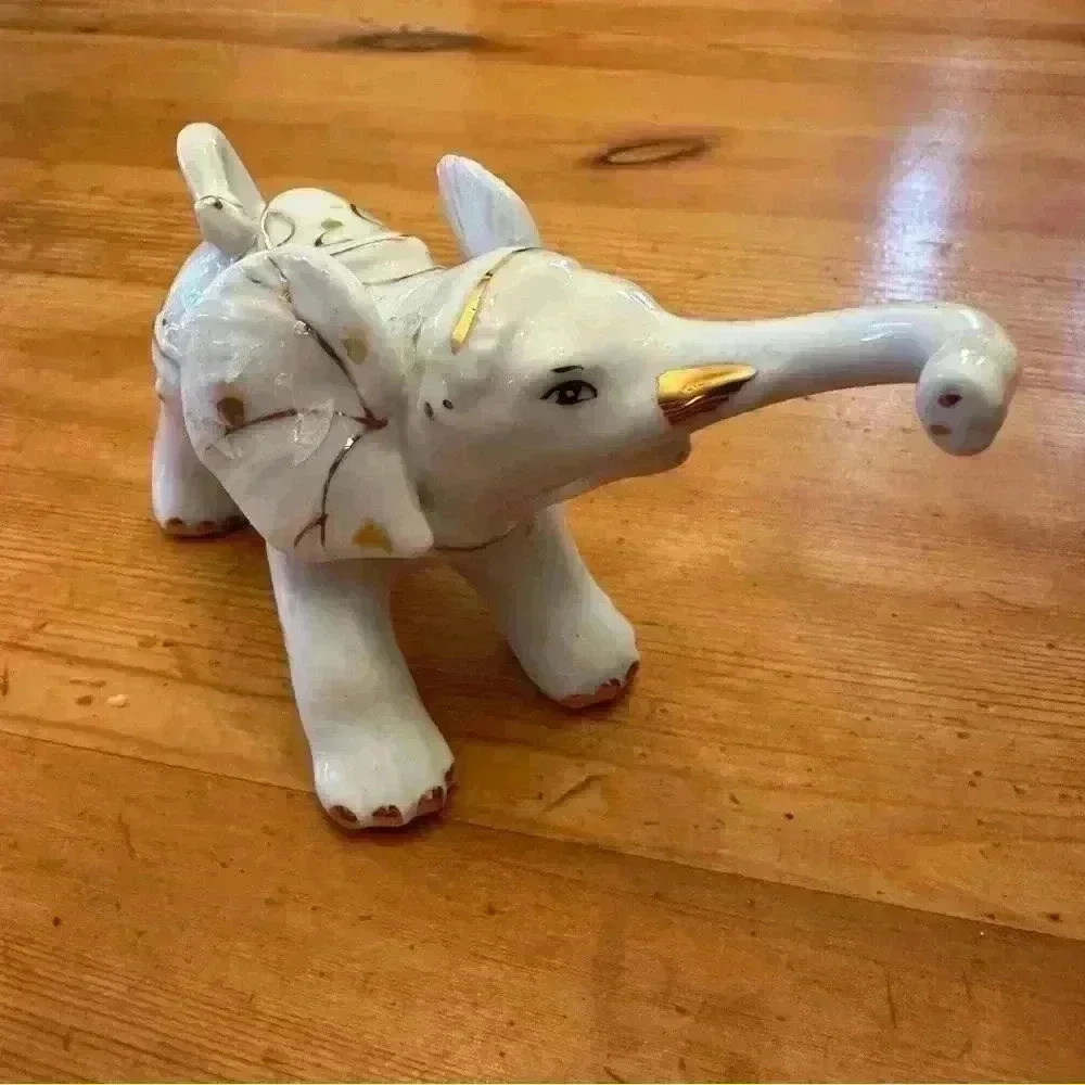 Porcelain with gold elephant figurine